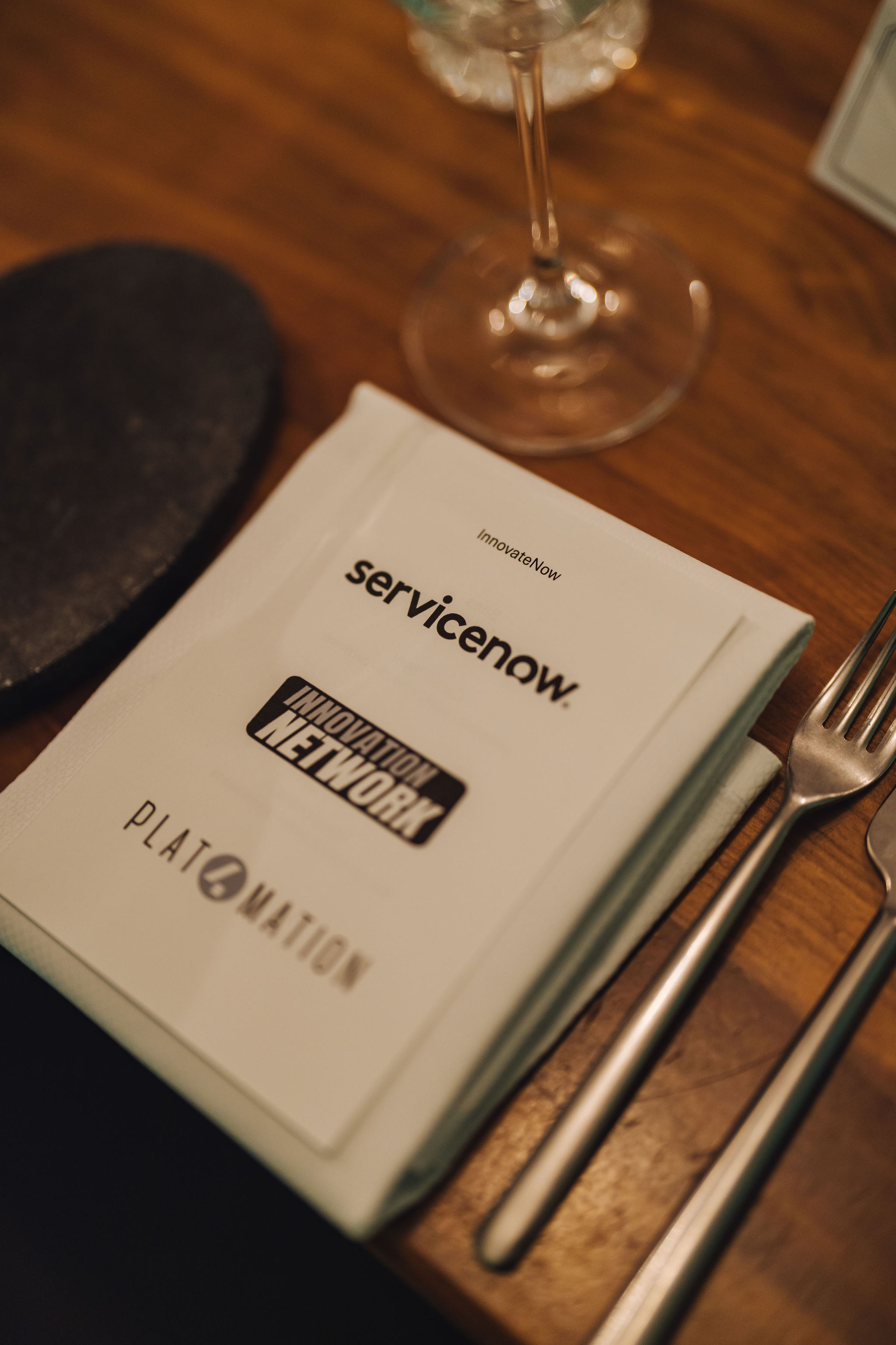 Napkin with the three host logos at each setting