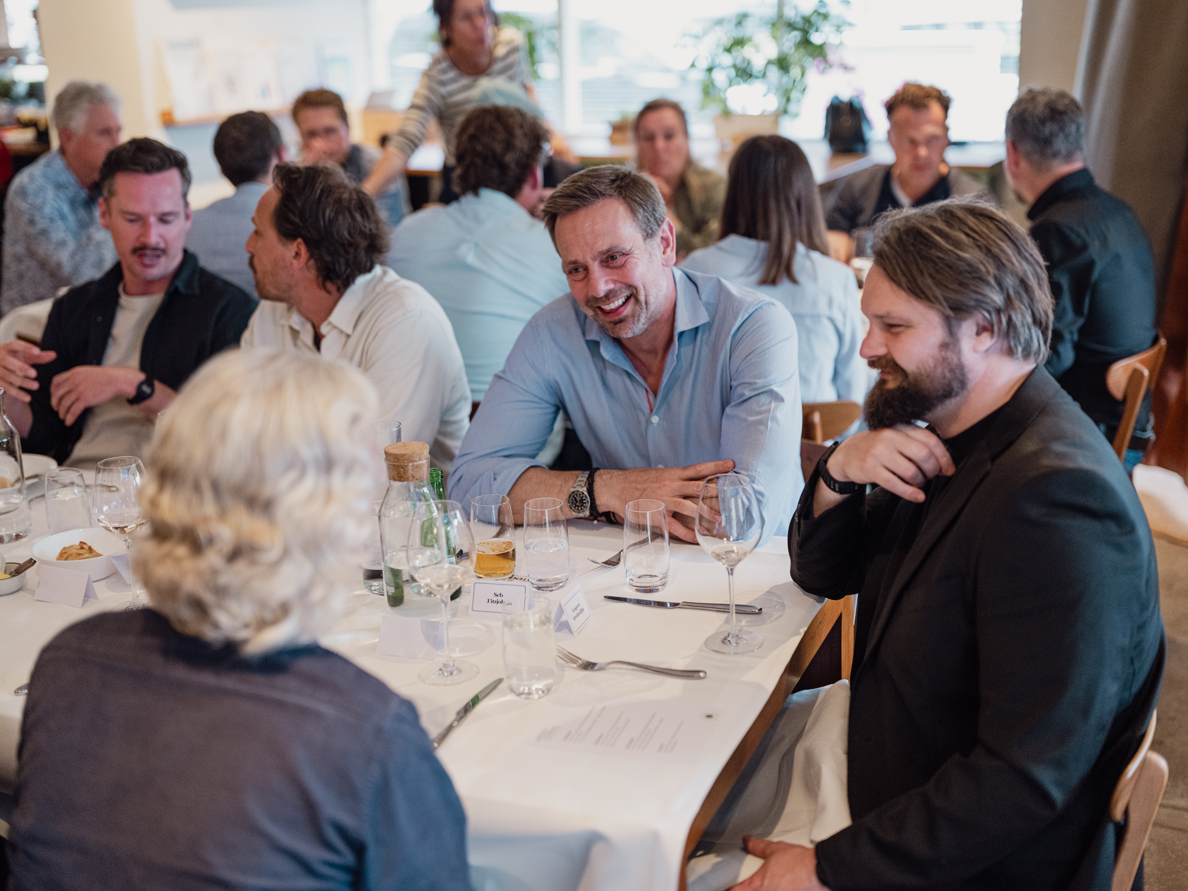 Guests in conversation around the table