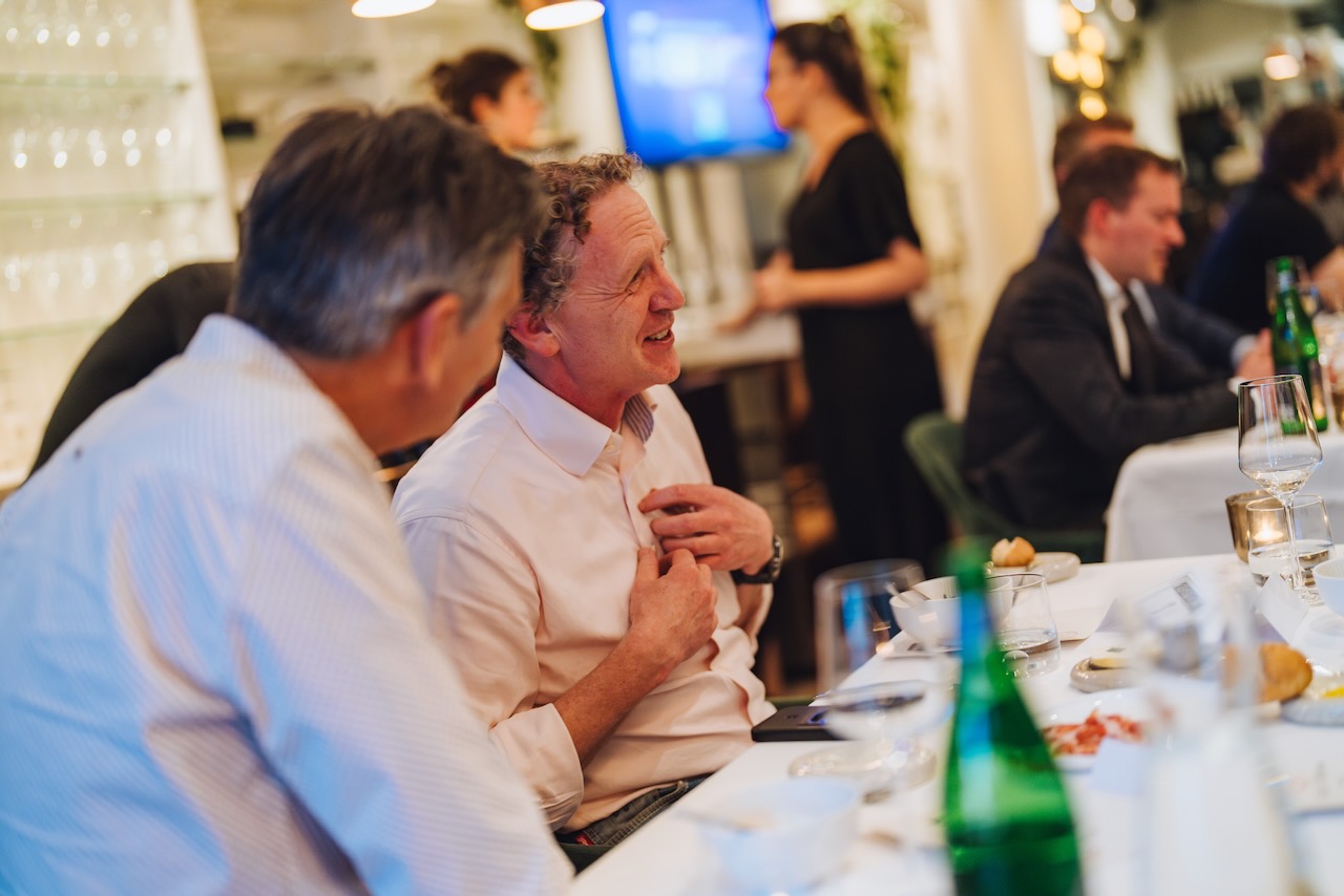A guest mid-conversation during dinner
