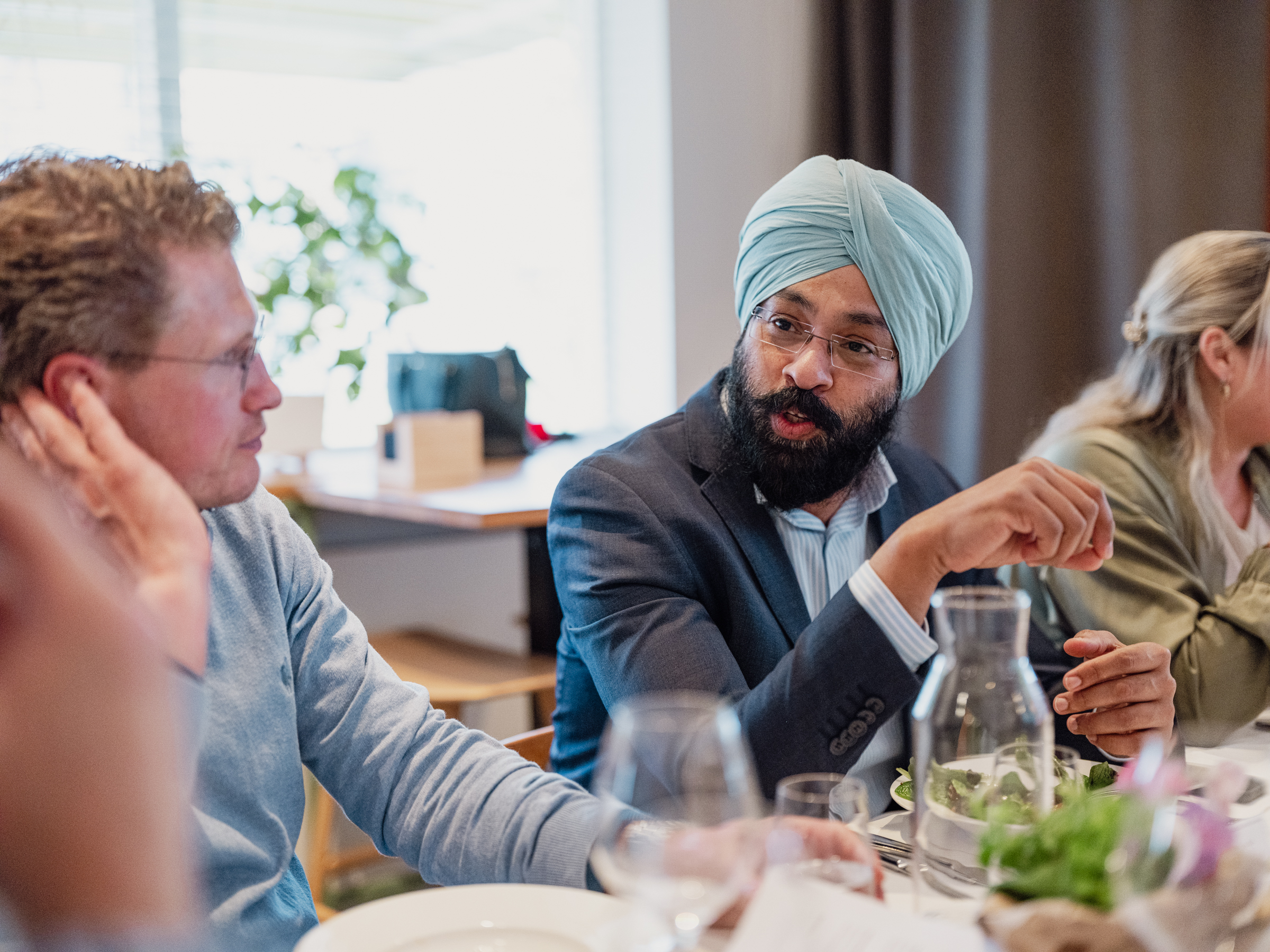 Guests engaged in conversation across the table